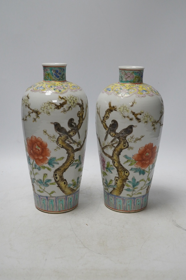 A pair of Chinese famille rose tapering vases, Qianlong mark but later, 23cm. Condition - good